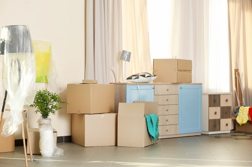 Professional office removals in Hainault with moving boxes and workplace equipment